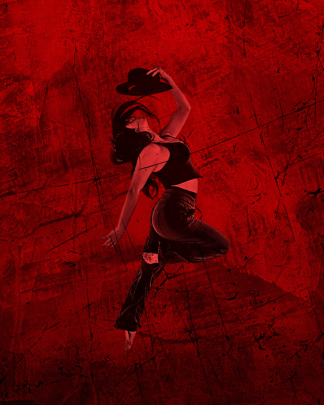 profile of female dancer holding black hat above her head with red lighting and red background