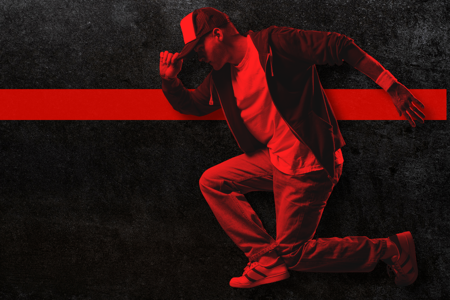 Male dancer with red color overlay and horizontal red stripe in the background
